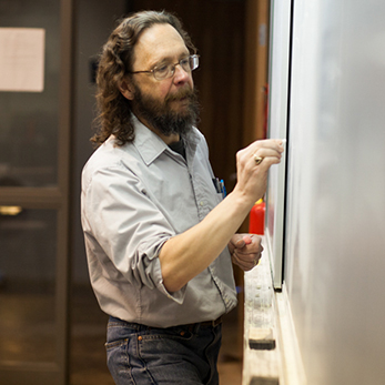 Professor David Myers at the blackboard.