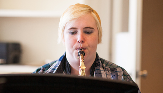 Student playing saxophone at jazz concert