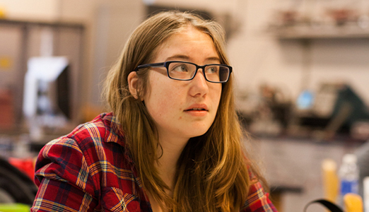 Female student in science class