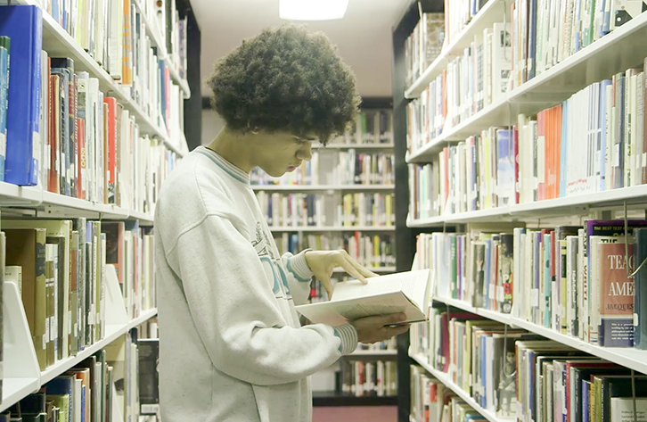 A student finds just the right book for his research.