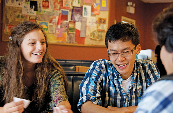 Students share stories in the informal lounge.