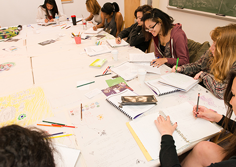 Writing workshop class engaged in curriculum work